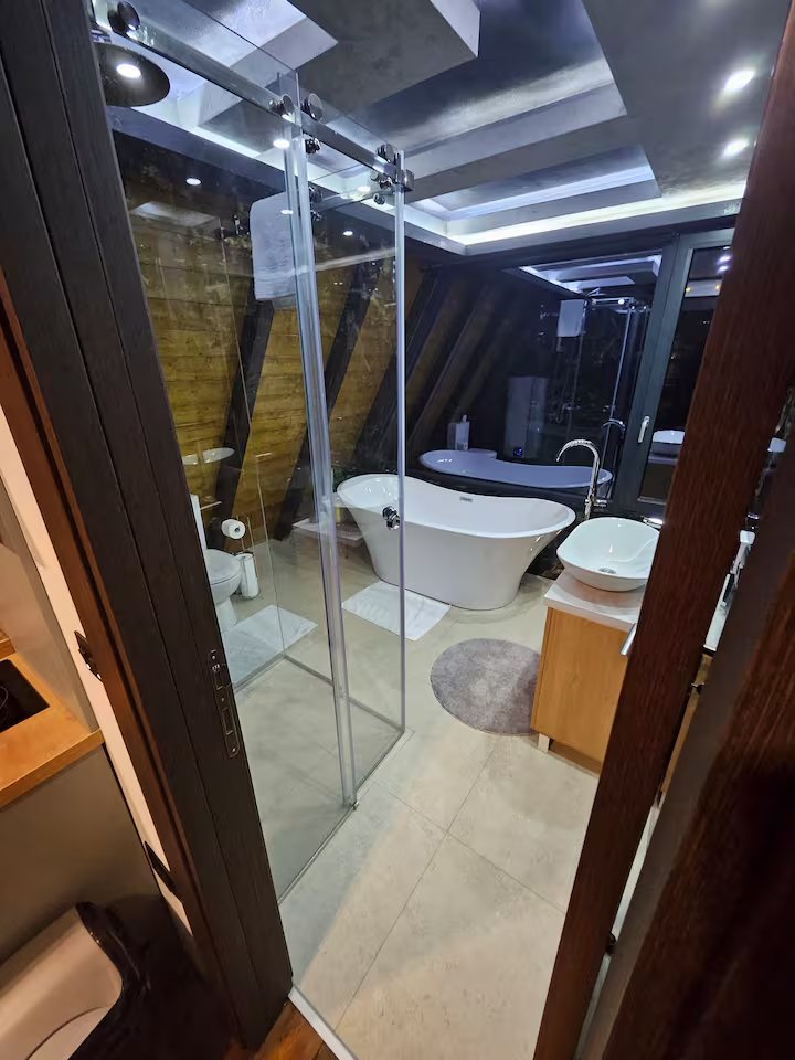 A-frame cabin exterior from artistic angle at night