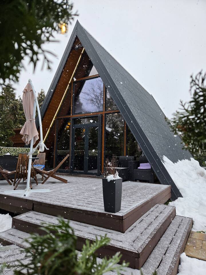 Covered BBQ terrace area in winter with snow