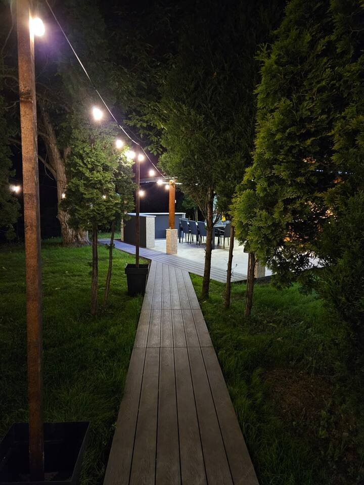 Bedroom with warm ambient lighting and wood walls