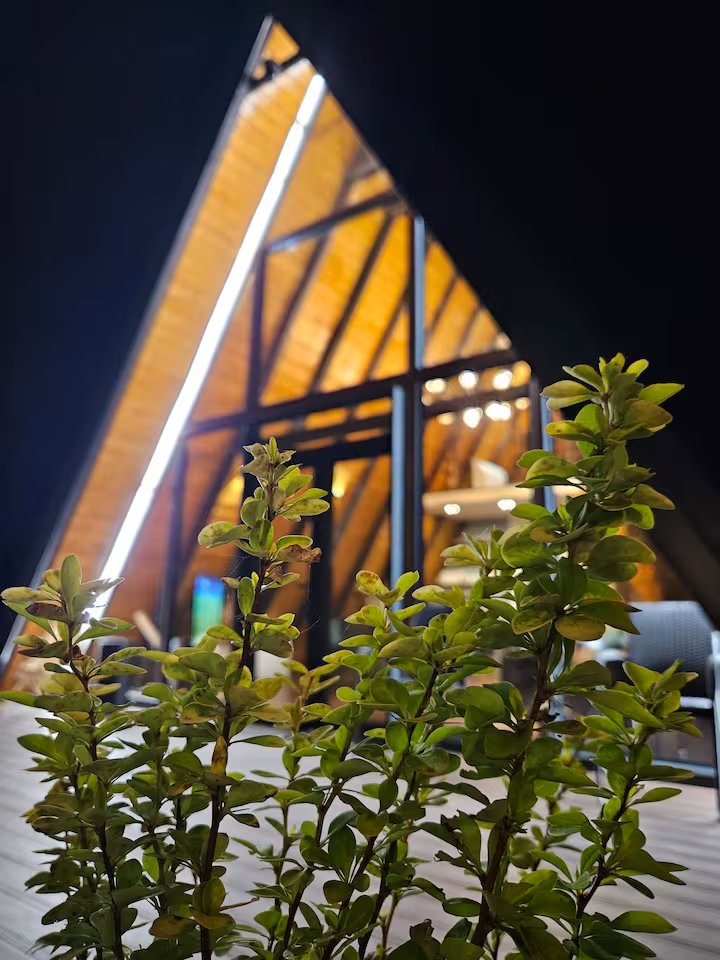 Interior view showing dramatic glass ceiling of A-frame