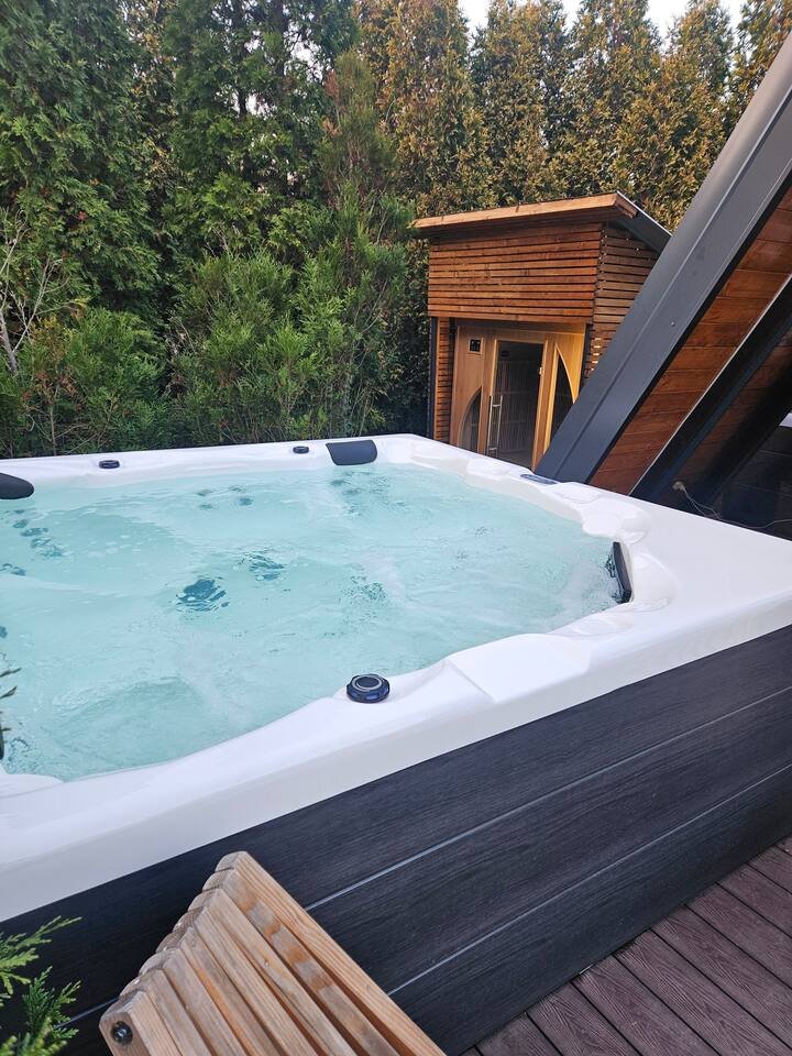 Outdoor jacuzzi with warm bubbling water close-up view