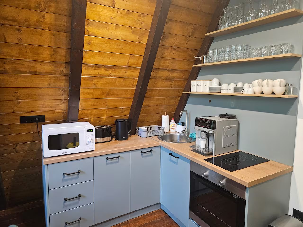 Kitchen with modern appliances and wood countertop