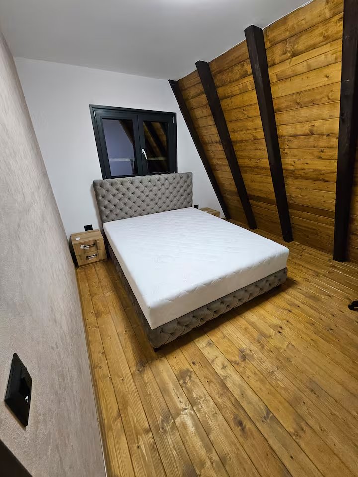 Outdoor dining table under covered terrace at night