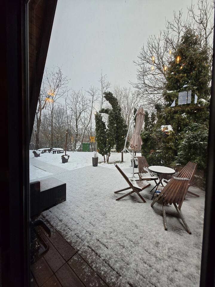 Outdoor terrace area beautifully lit at night