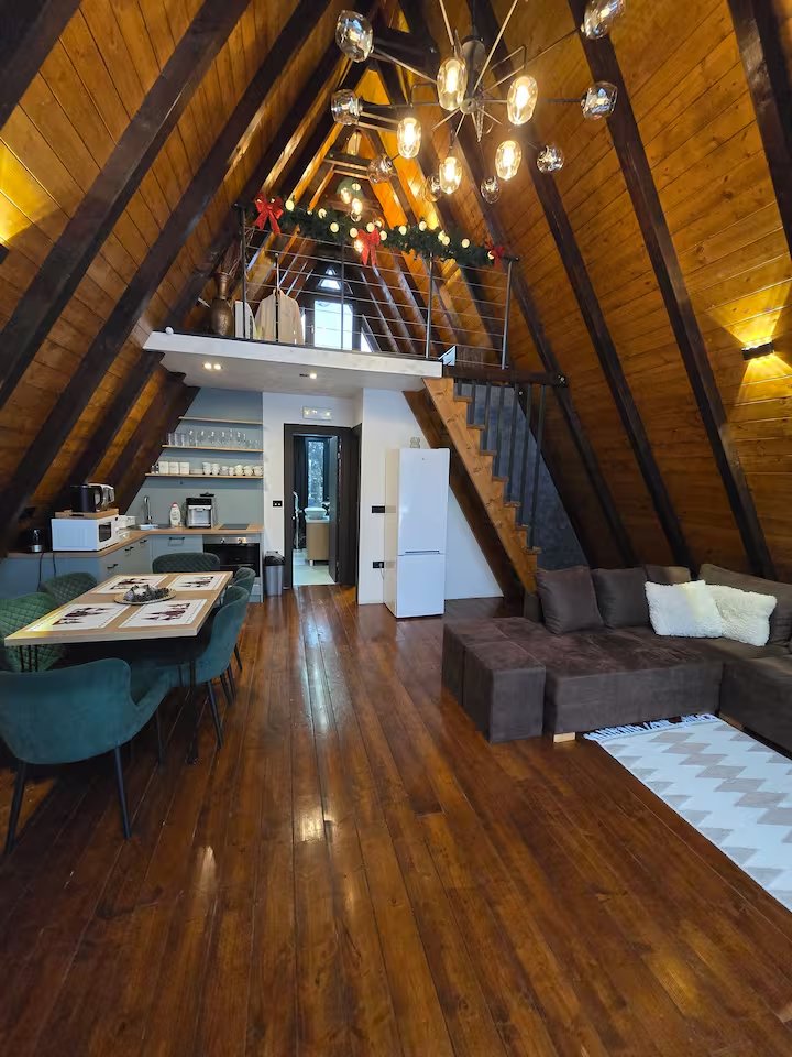 Large outdoor pool glowing blue in the evening